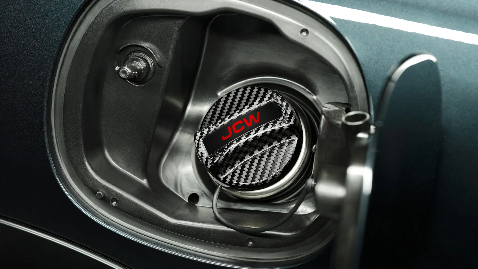 Acessórios JCW - Tampa do tanque de combustível JCW em fibra de carbono.